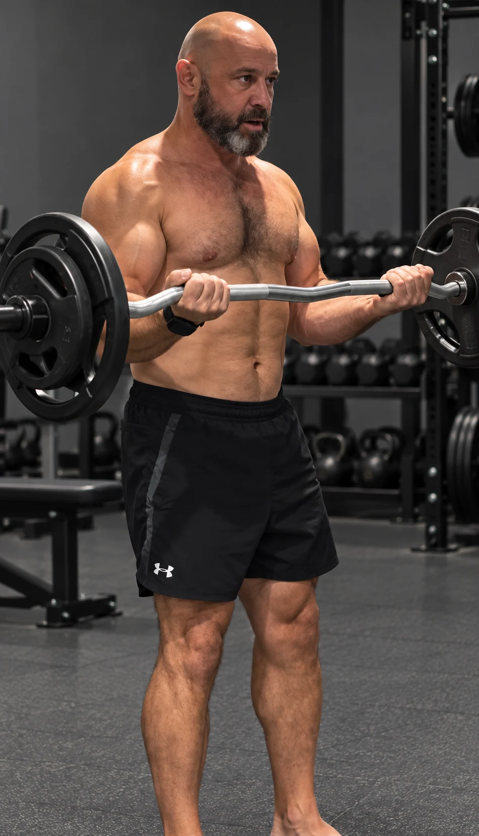 Paul Woodcock, personal trainer, demonstrating an EZ-bar curl